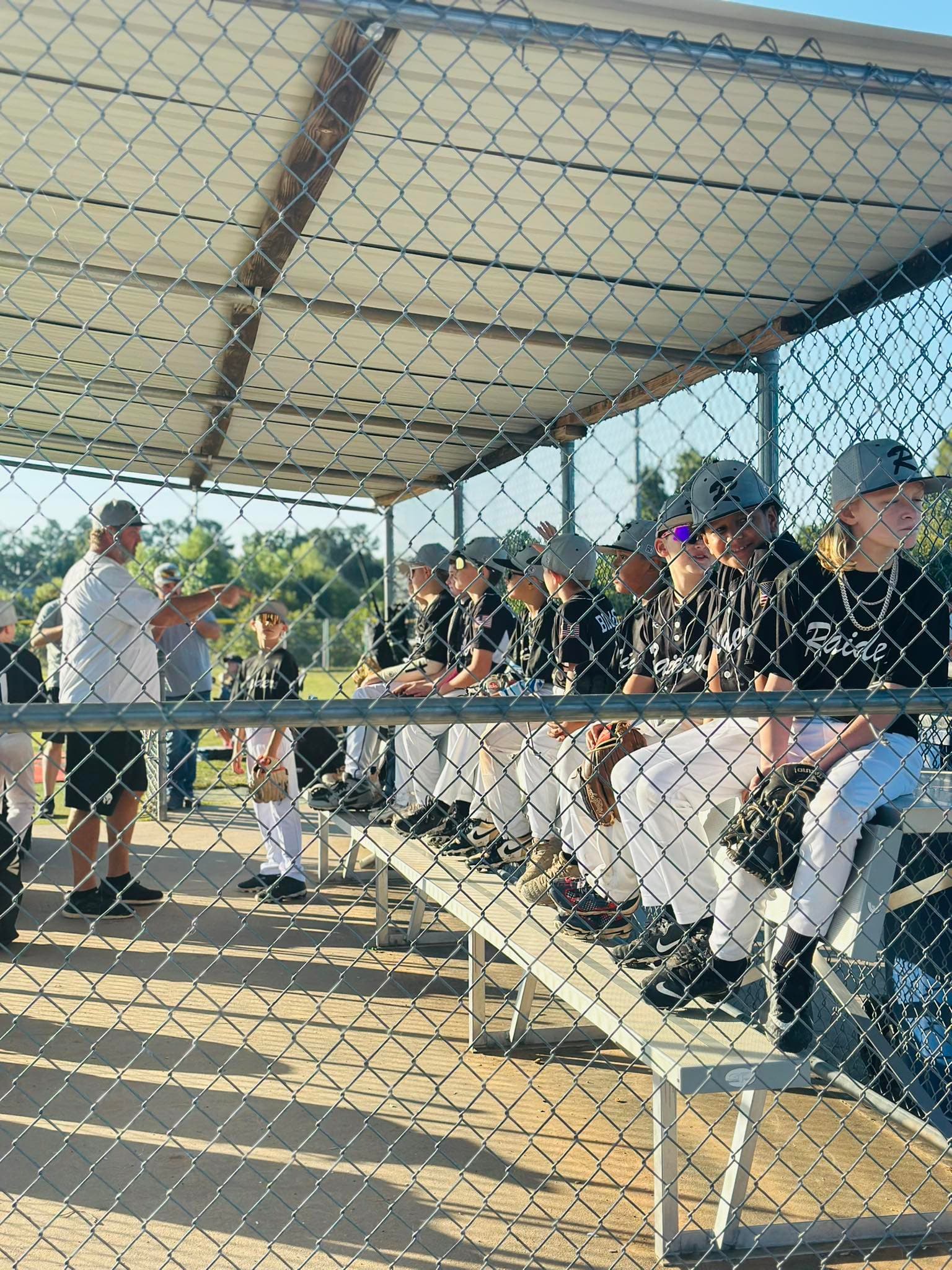OKC Raiders baseball team in dugout